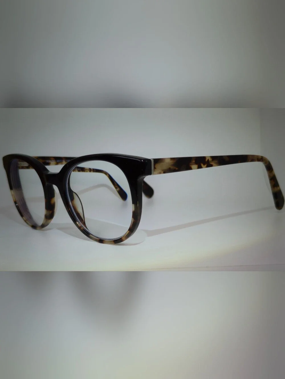 Rialto. Classic Round Black Upper, Animal Print Lower And Temples.